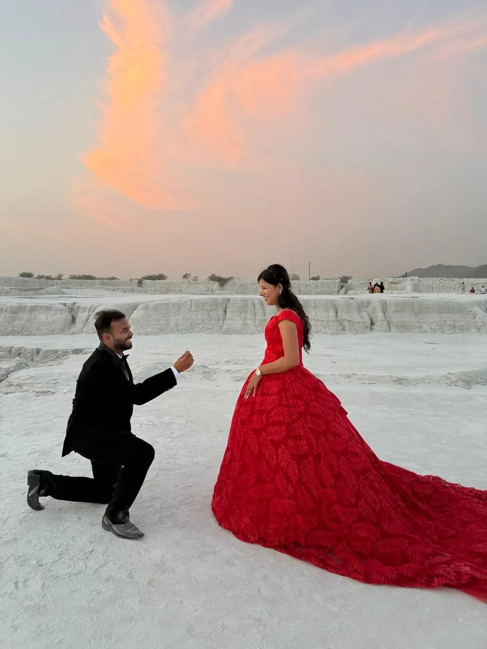 The proposal at the Kishangarh marble flats, ring held out at sunset